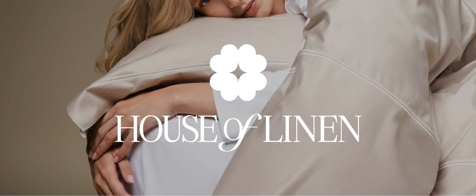 White House of Linen pillows with the brand’s logo overlaid on the photograph